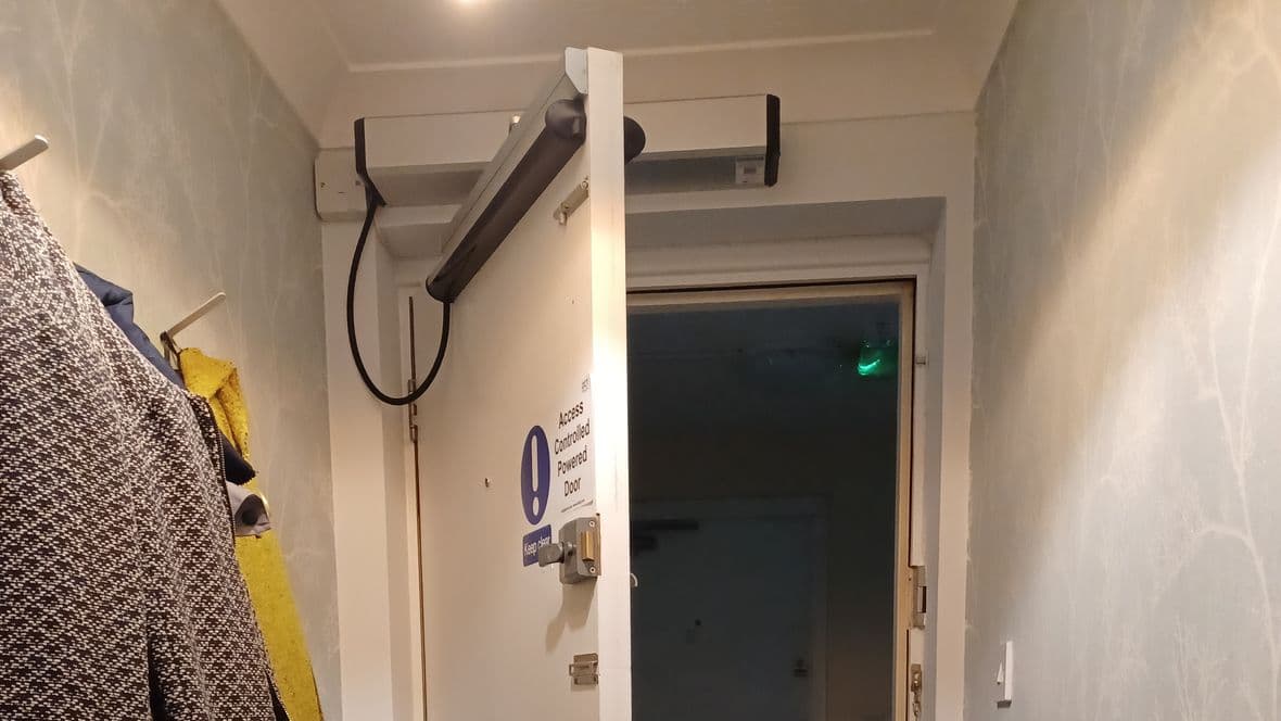 Access controlled powered front door