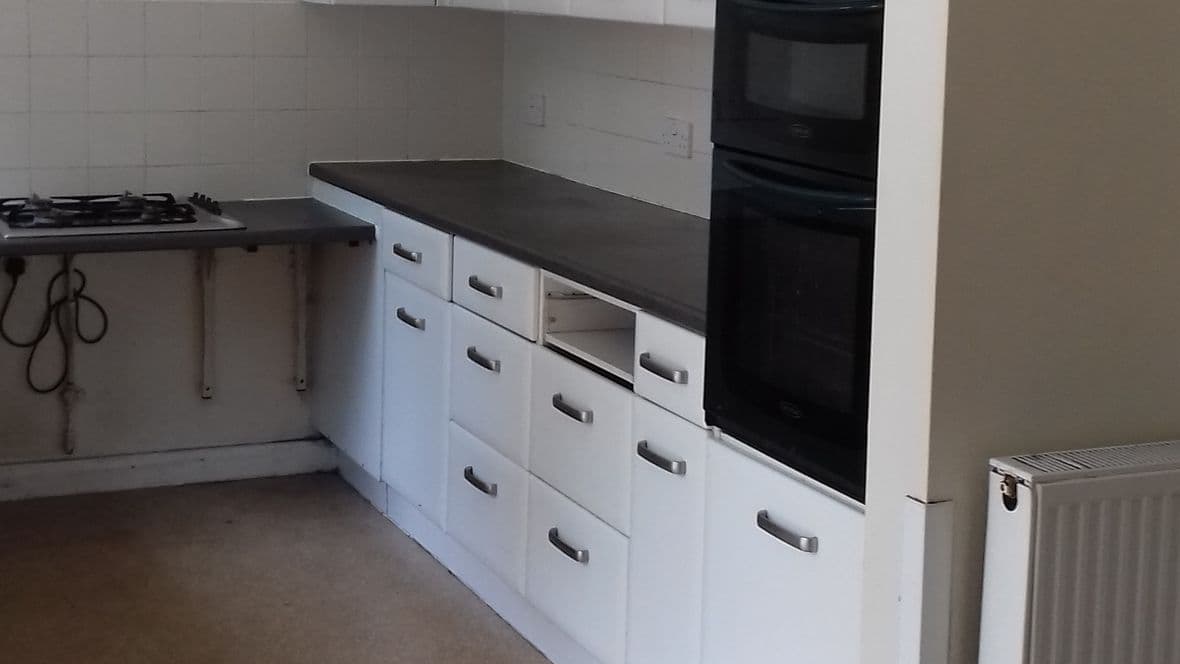 kitchen rearranged to provide continuous work top